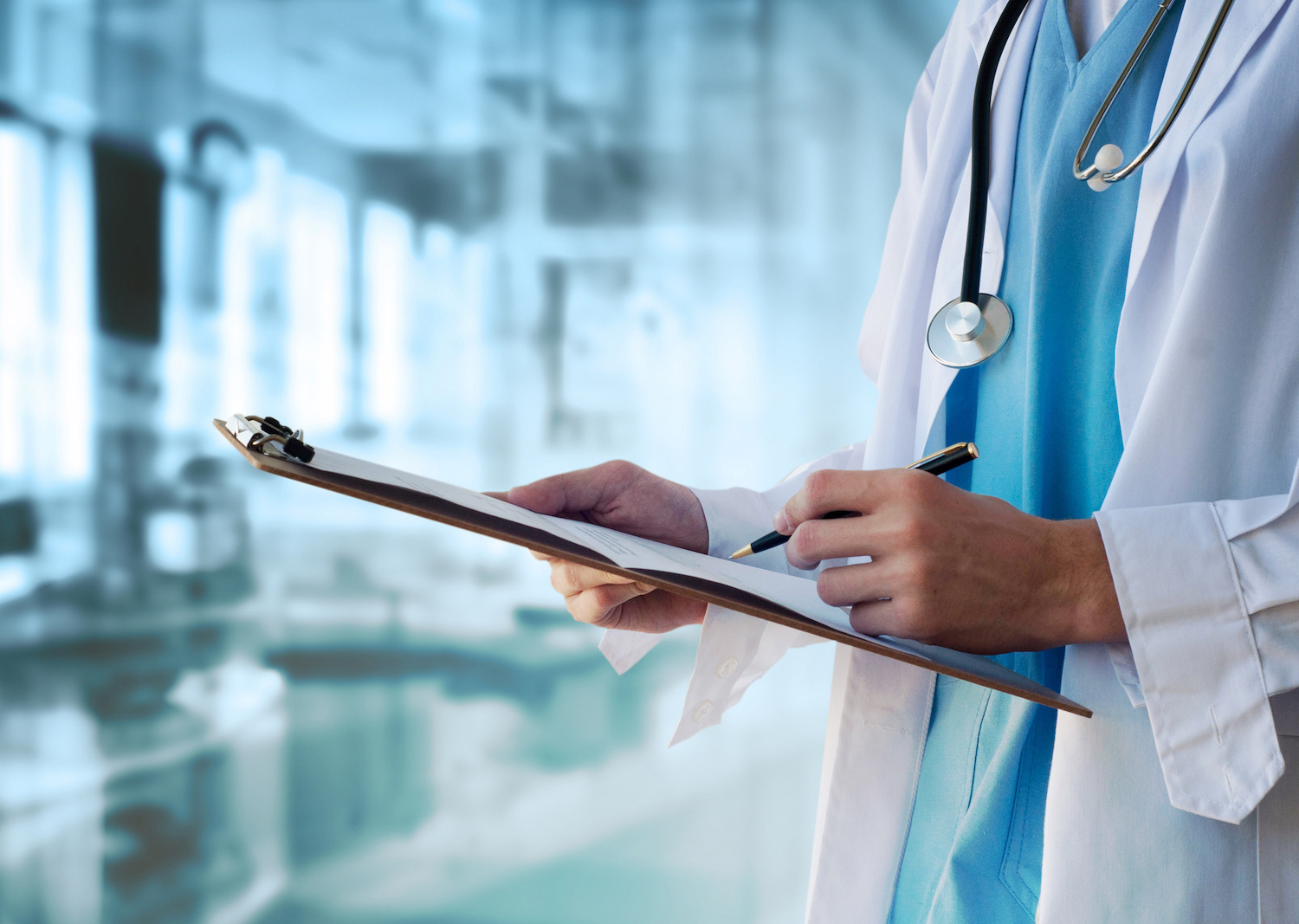 Doctor writing notes on a clipboard