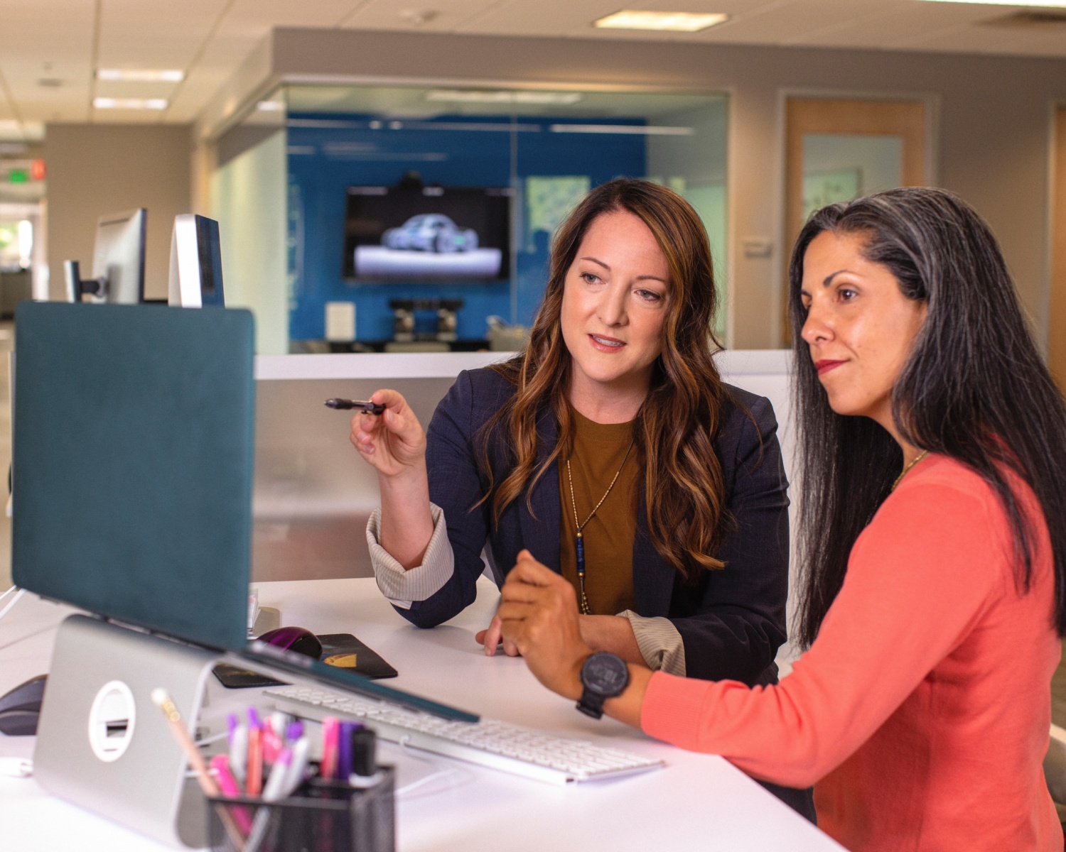 Customer service - two women talking about a project