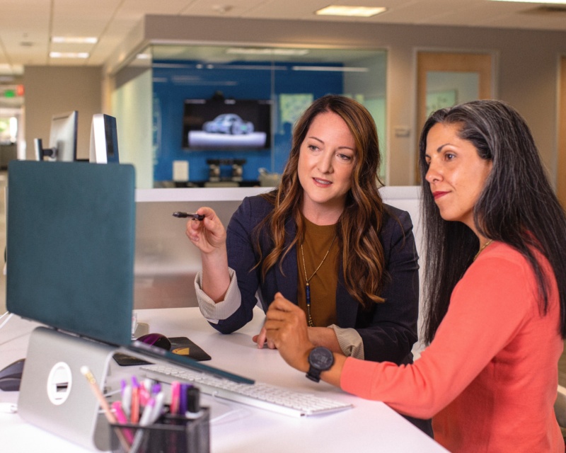 Customer service - two women talking about a project