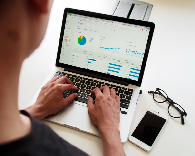 Someone looking at a analytics report on their computer
