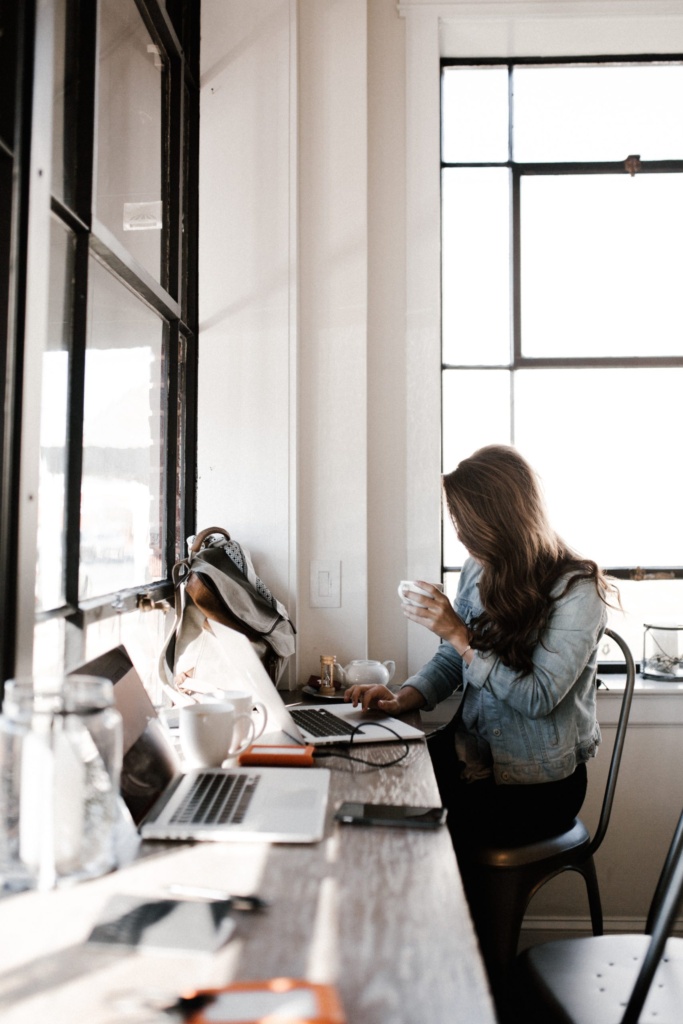 Managing marketing tasks effectively Woman inputing information into her laptop.