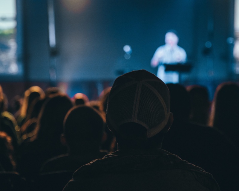 Audience of people looking at a speaker