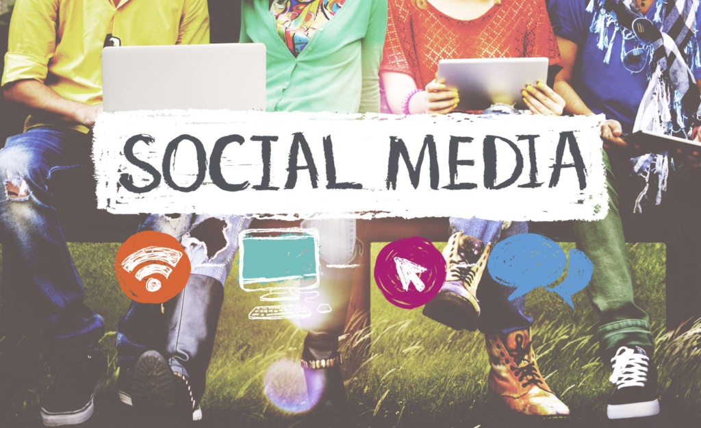 Social media engagement and digital marketing Group of people using laptops and tablets with the words “Social Media” displayed across the image.