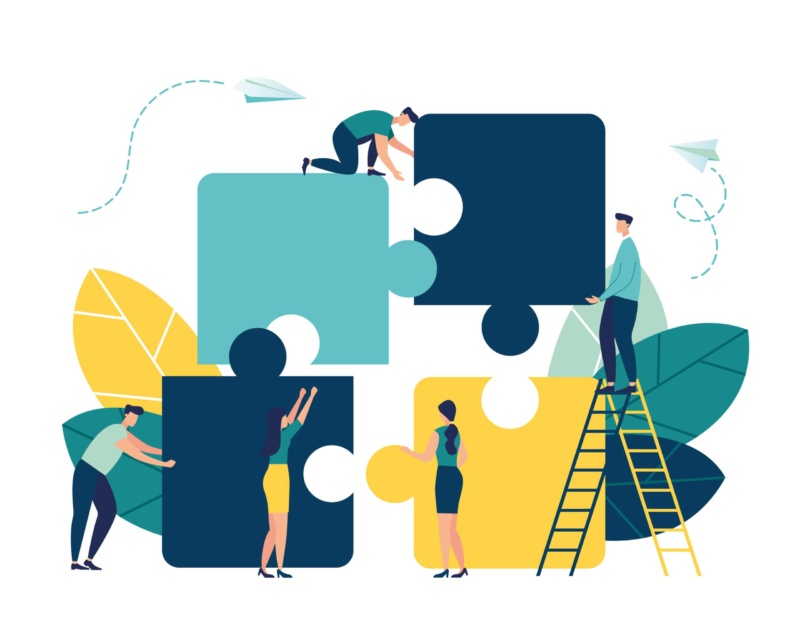 Puzzle pieces showing people working together