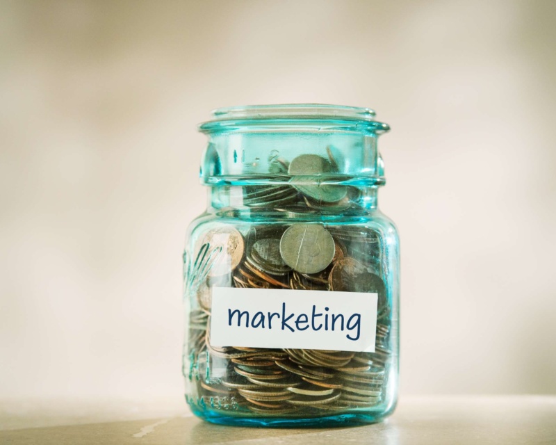 A glass jar full of coins