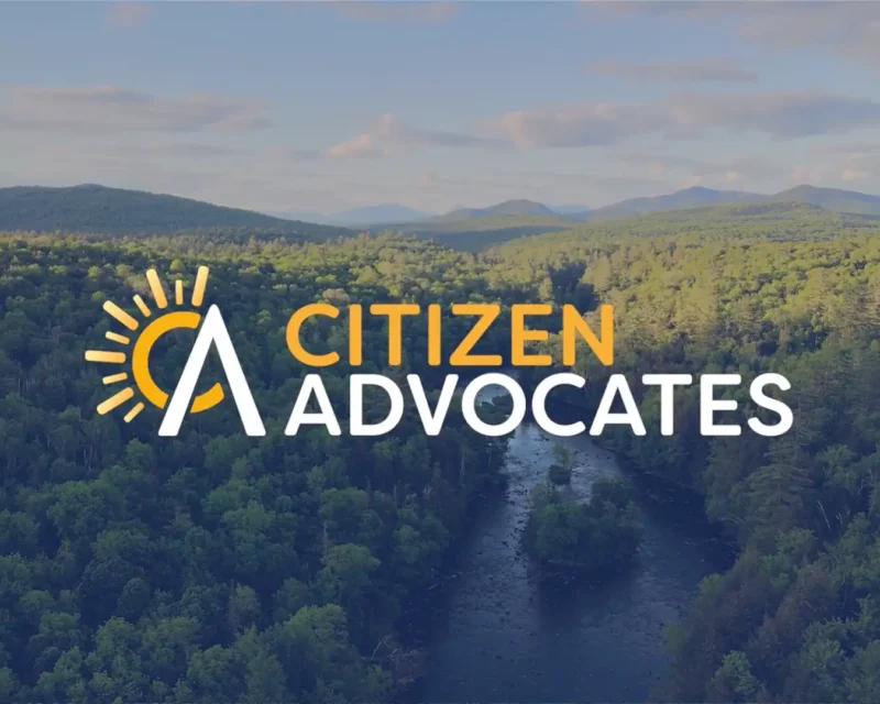 Citizen Advocates logo in front of beautiful Northern New York scenery