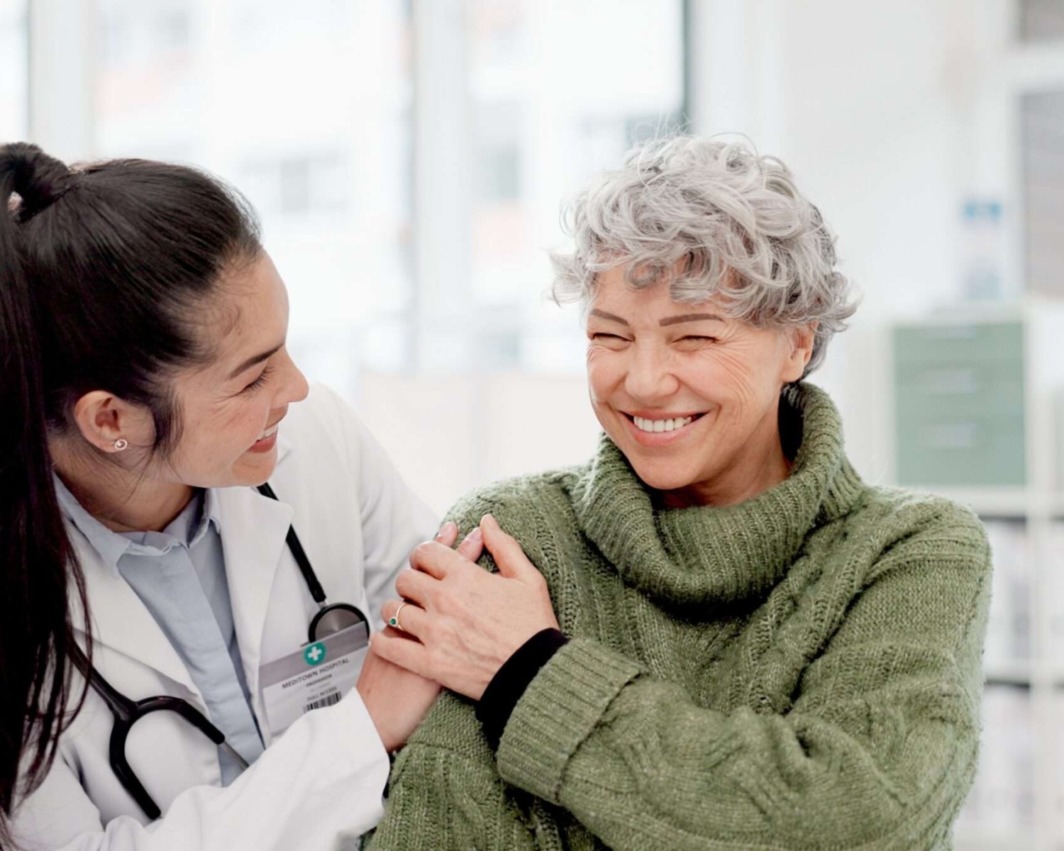 A doctor treating a happy patient