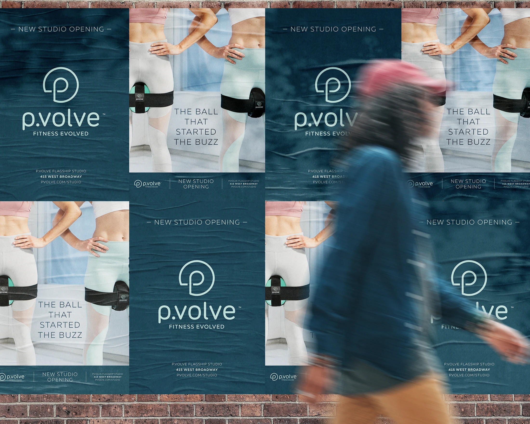 The Pvolve logo and the pball in motion strapped onto someones legs plastered on a subway station wall in New York City