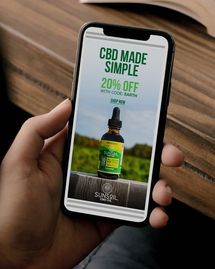 Sunsoil CBD Oil advertisement displayed on phone being held by a person