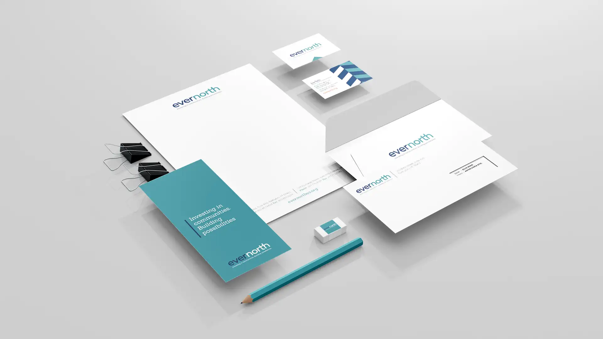 Image of Evernorth office collateral: letterhead, business card, envelope, pencil, eraser